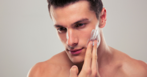 Handsome Man Applying Skincare Products