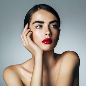 brunette woman with bright red lipstick